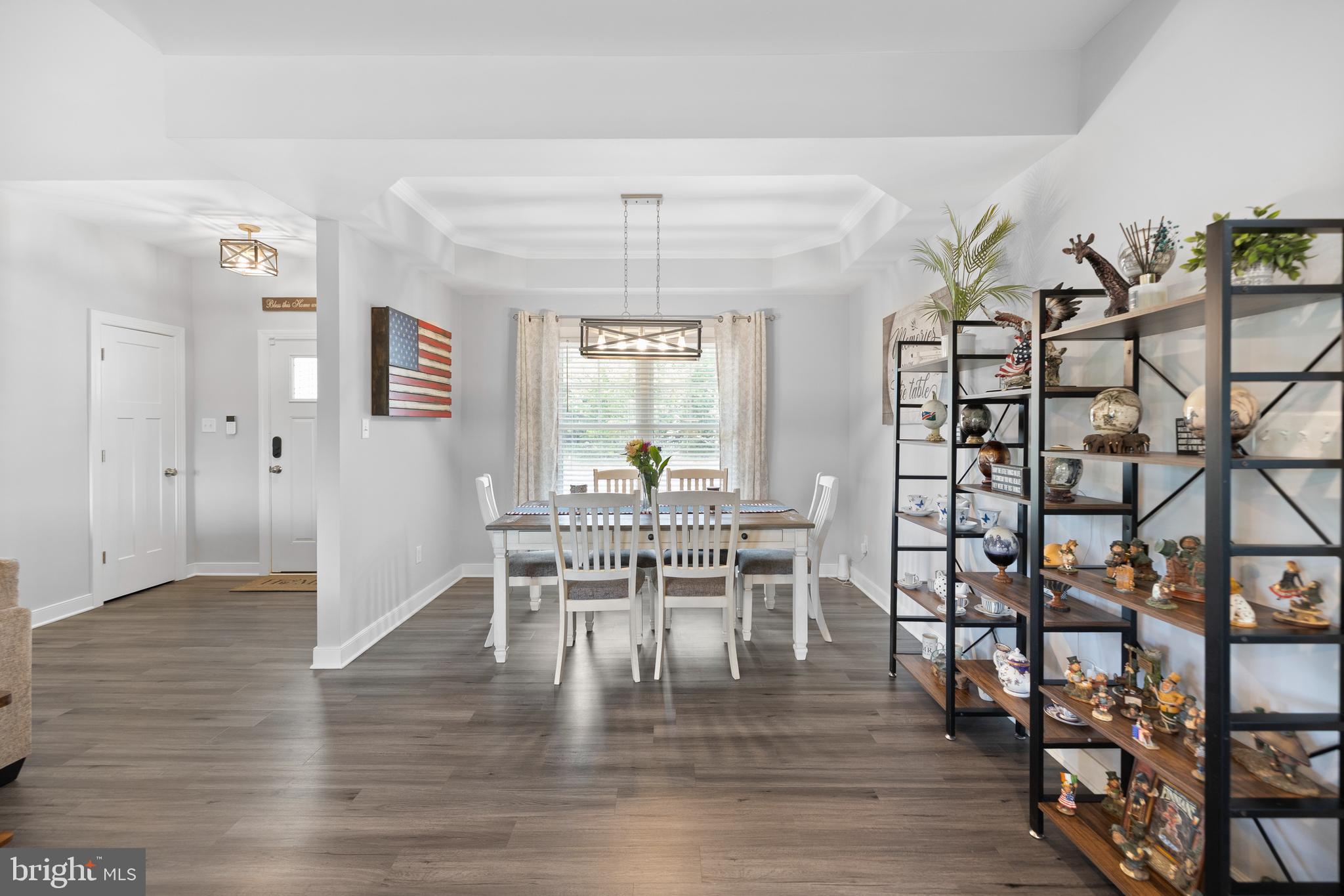 5175 Paynes Mill Road Bumpass, VA 23024 - Photo 14 of 55 a view of a dining room with furniture and wooden floor