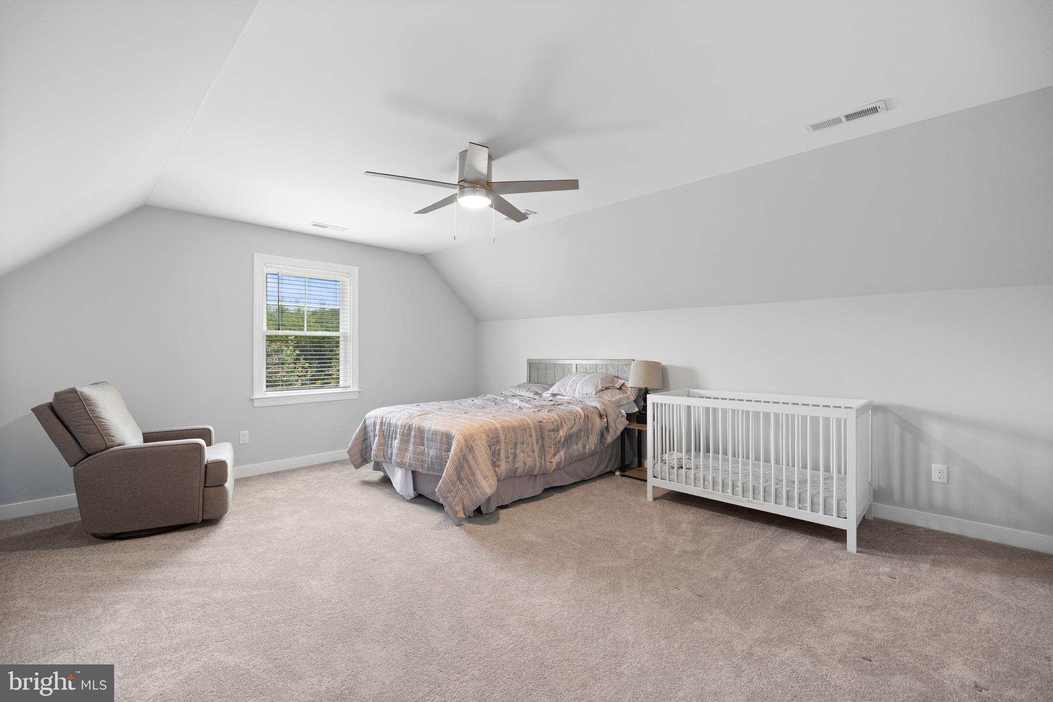 5175 Paynes Mill Road Bumpass, VA 23024 - Photo 34 of 55 a bedroom with a bed and a couch