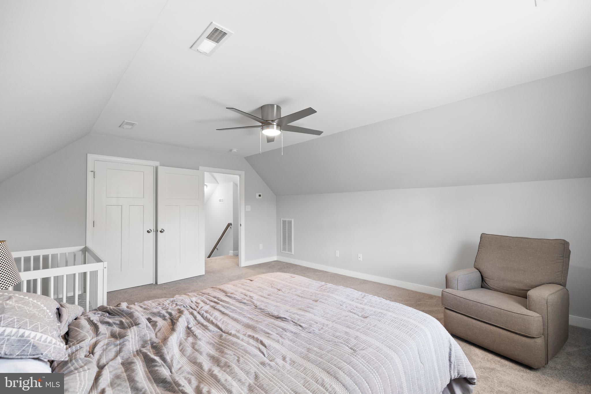 5175 Paynes Mill Road Bumpass, VA 23024 - Photo 35 of 55 a bedroom with a bed and a couch