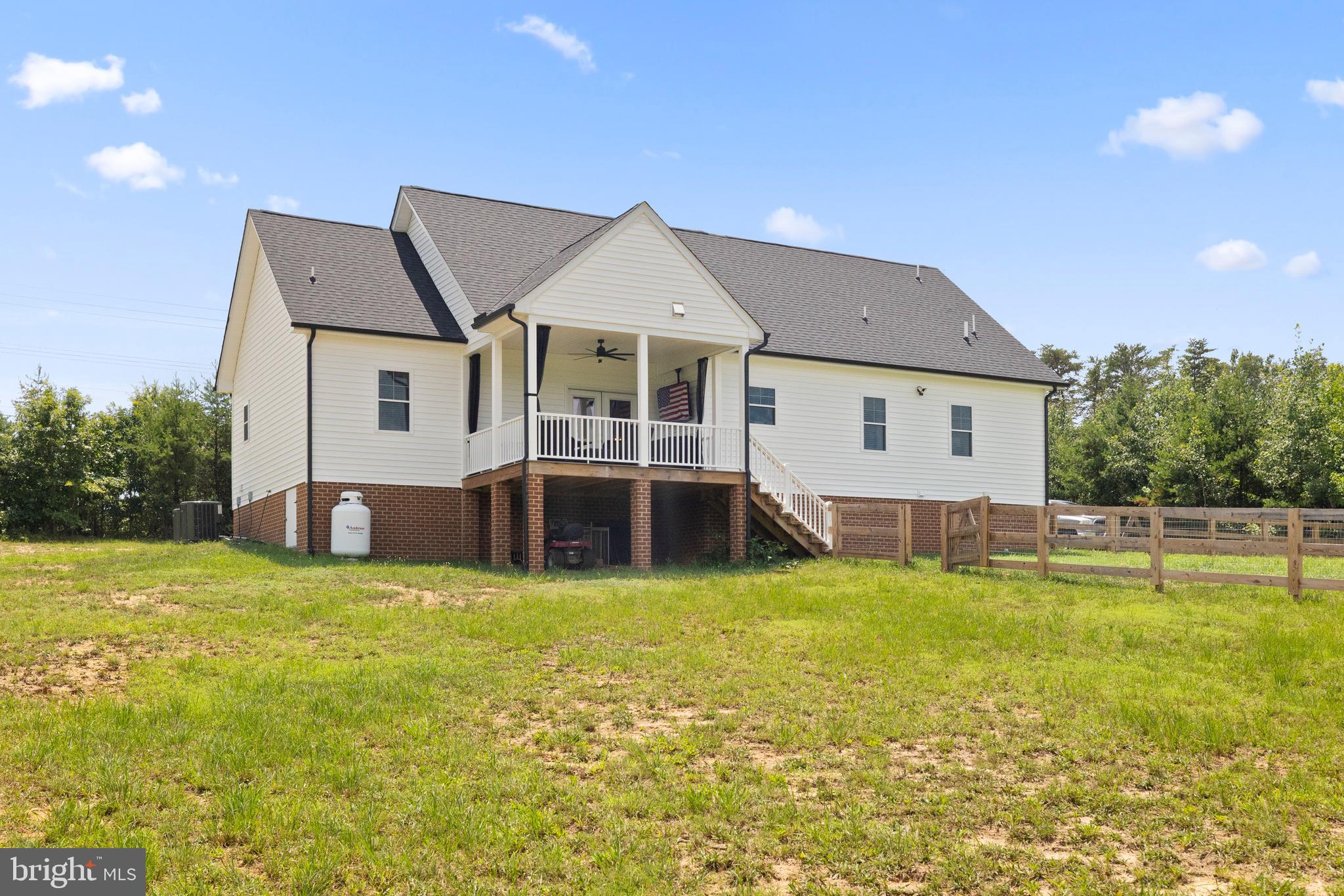 5175 Paynes Mill Road Bumpass, VA 23024 - Photo 47 of 55 a view of a house with a yard and sitting area