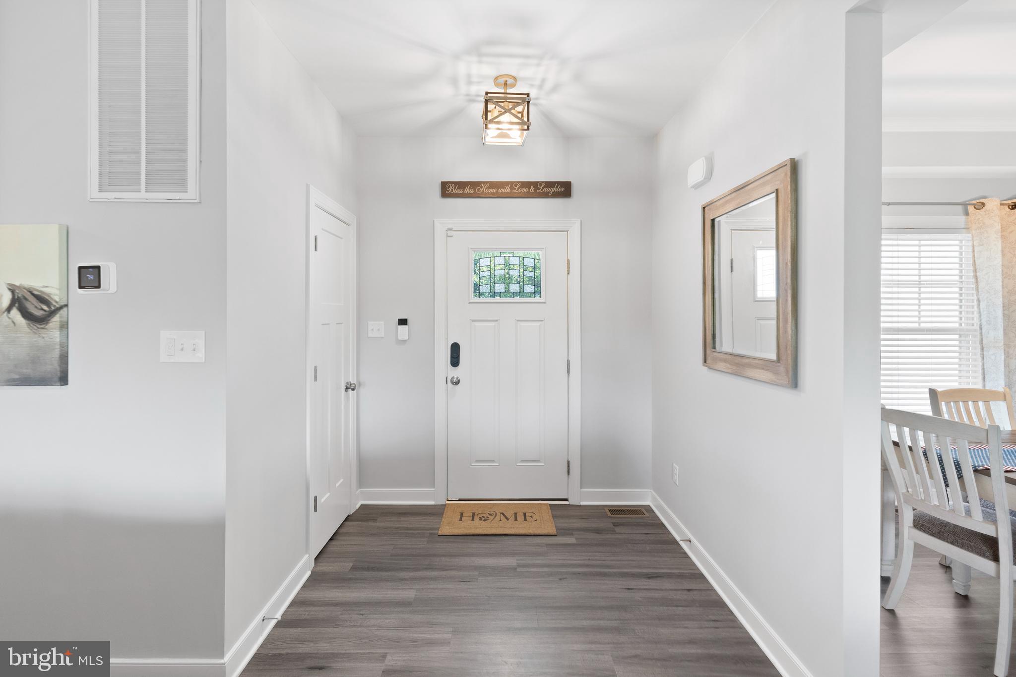 5175 Paynes Mill Road Bumpass, VA 23024 - Photo 8 of 55 a view of an entryway with wooden floor