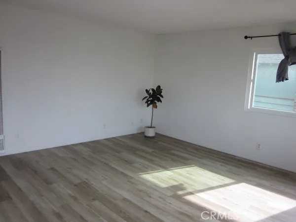 a view of a room with a wooden floor