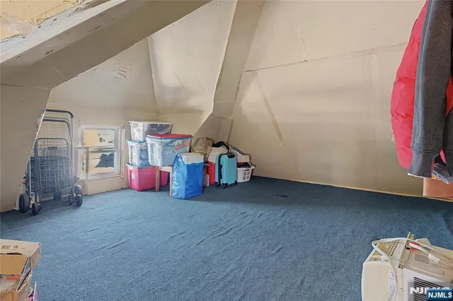 a view of game room with windows