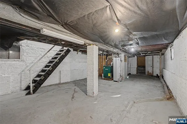 a view of an empty room with stairs