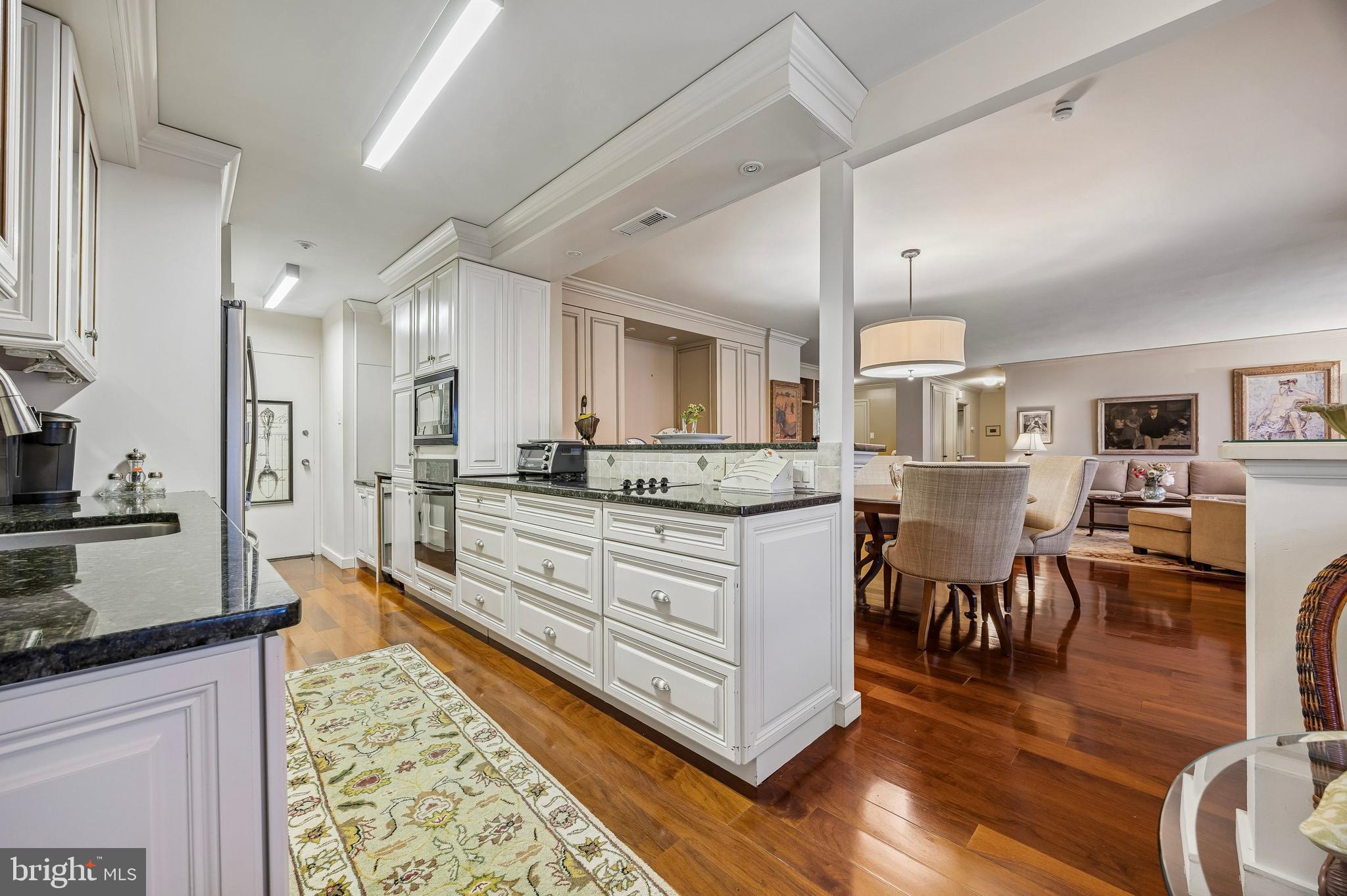 41 Conshohocken State Road, Unit 603 Bala Cynwyd, PA 19004 - Photo 8 of 37 a large kitchen with stainless steel appliances kitchen island granite countertop a large island in the center