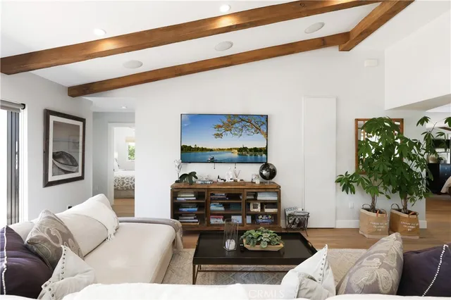 a view of a roof deck with couches and sky view