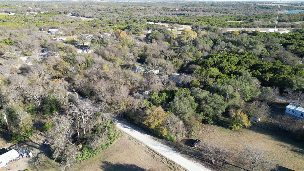 734-735 Cherry Road Whitney, TX 76692 - Photo 17 of 27 an aerial view of residential house with parking space