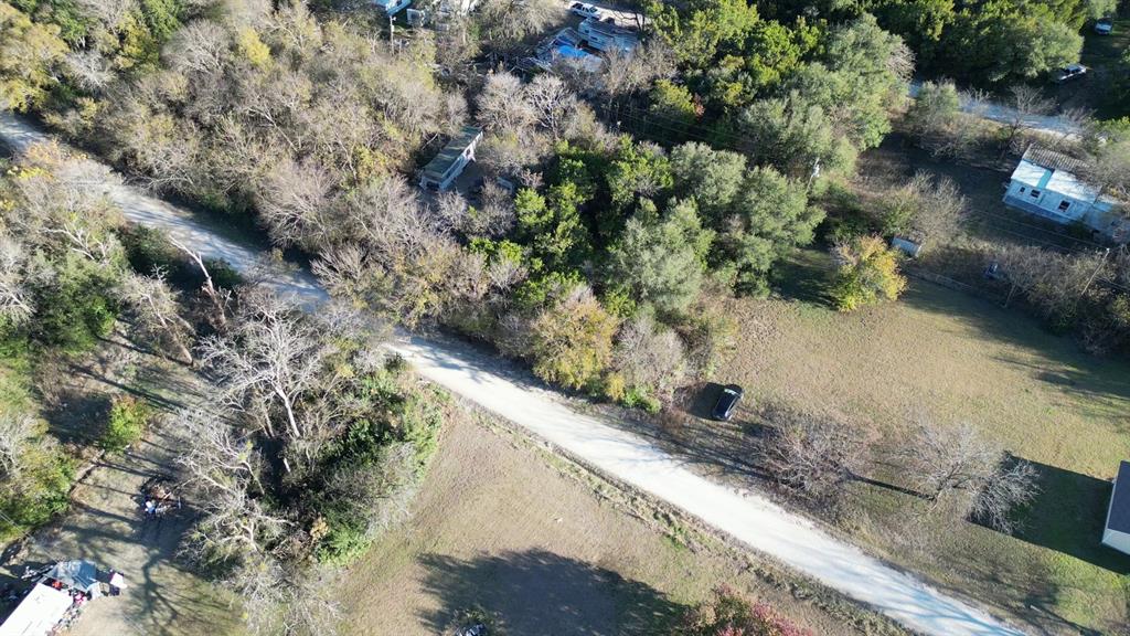 734-735 Cherry Road Whitney, TX 76692 - Photo 20 of 27 a view of a yard with a tree