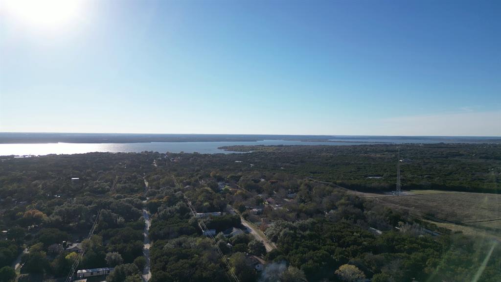 734-735 Cherry Road Whitney, TX 76692 - Photo 21 of 27 an aerial view of residential house and green space