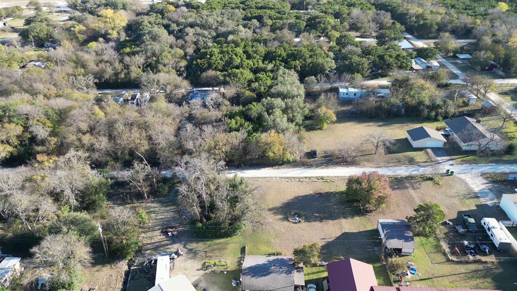 734-735 Cherry Road Whitney, TX 76692 - Photo 5 of 27 an aerial view of a house with a yard