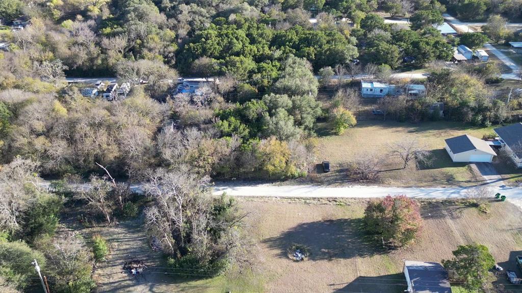 734-735 Cherry Road Whitney, TX 76692 - Photo 7 of 27 an aerial view of a house with a yard
