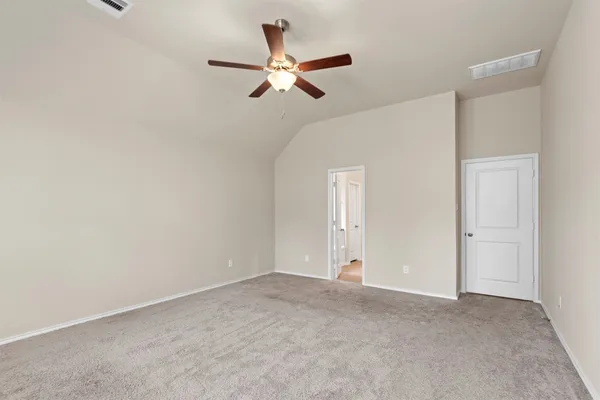 a view of a livingroom with a ceiling fan and window