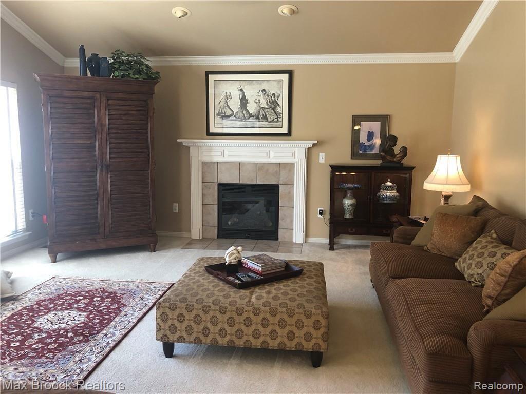 30 Ridge Field Court Oxford, MI 48371 - Photo 16 of 45 Cathedral ceiling and big windows add to the size of the large Family room.