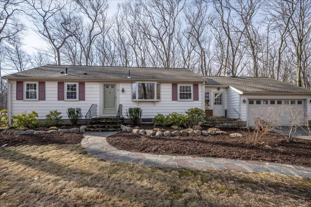 24 Oregon Road Ashland, MA 01721 - Photo 1 of 42 a front view of a house with garden