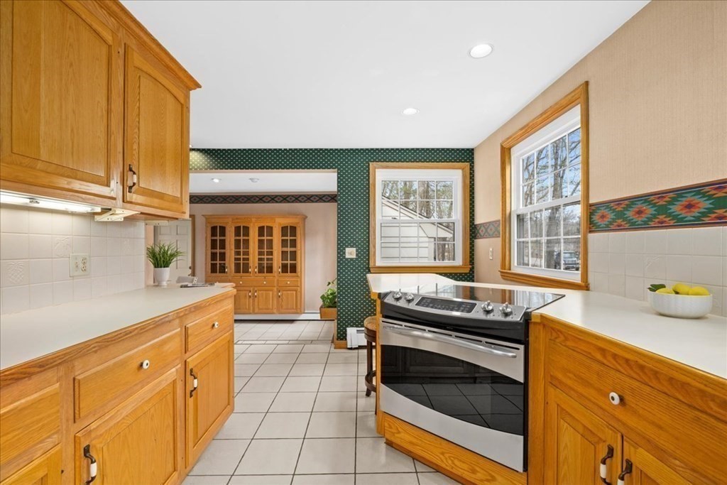 24 Oregon Road Ashland, MA 01721 - Photo 14 of 42 a kitchen with granite countertop a stove and a sink