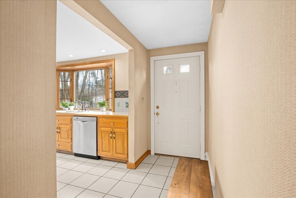 24 Oregon Road Ashland, MA 01721 - Photo 15 of 42 a view of kitchen with granite countertop cabinets and window