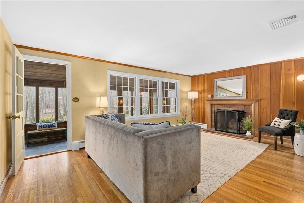 24 Oregon Road Ashland, MA 01721 - Photo 16 of 42 a living room with furniture and a fireplace