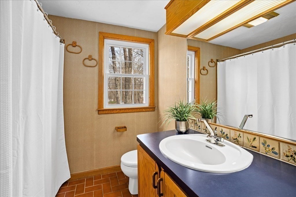 24 Oregon Road Ashland, MA 01721 - Photo 26 of 42 a bathroom with a sink toilet and shower