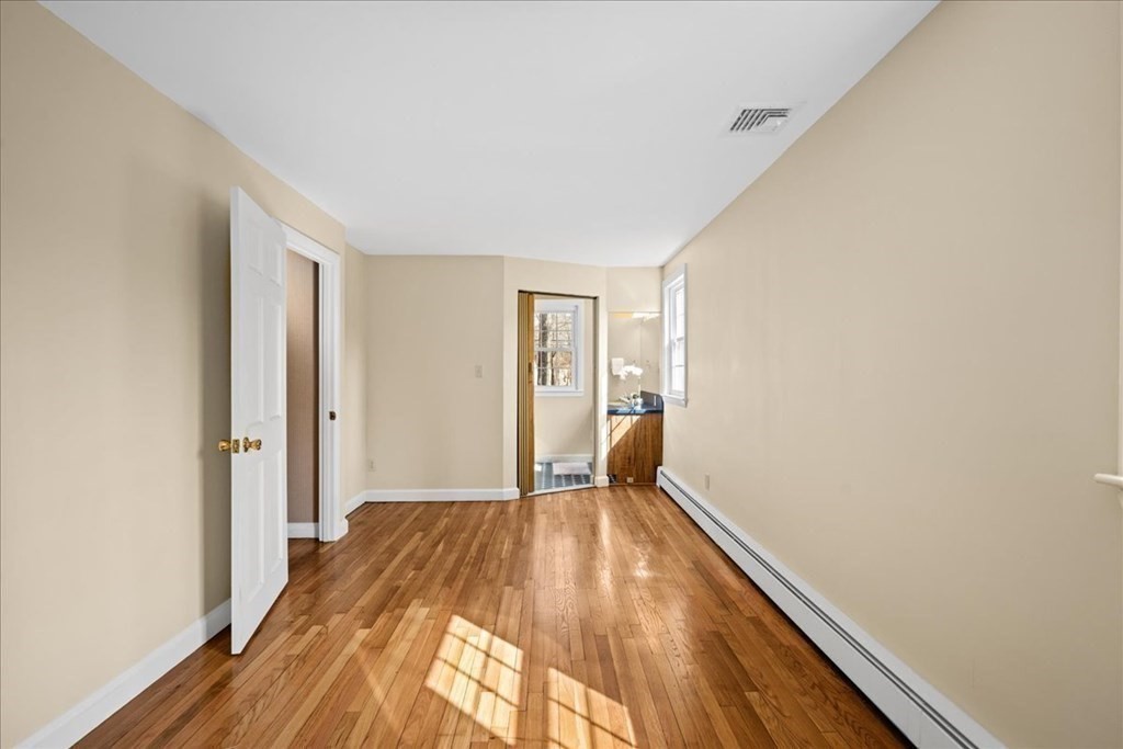 24 Oregon Road Ashland, MA 01721 - Photo 31 of 42 a view of a bedroom from a hallway