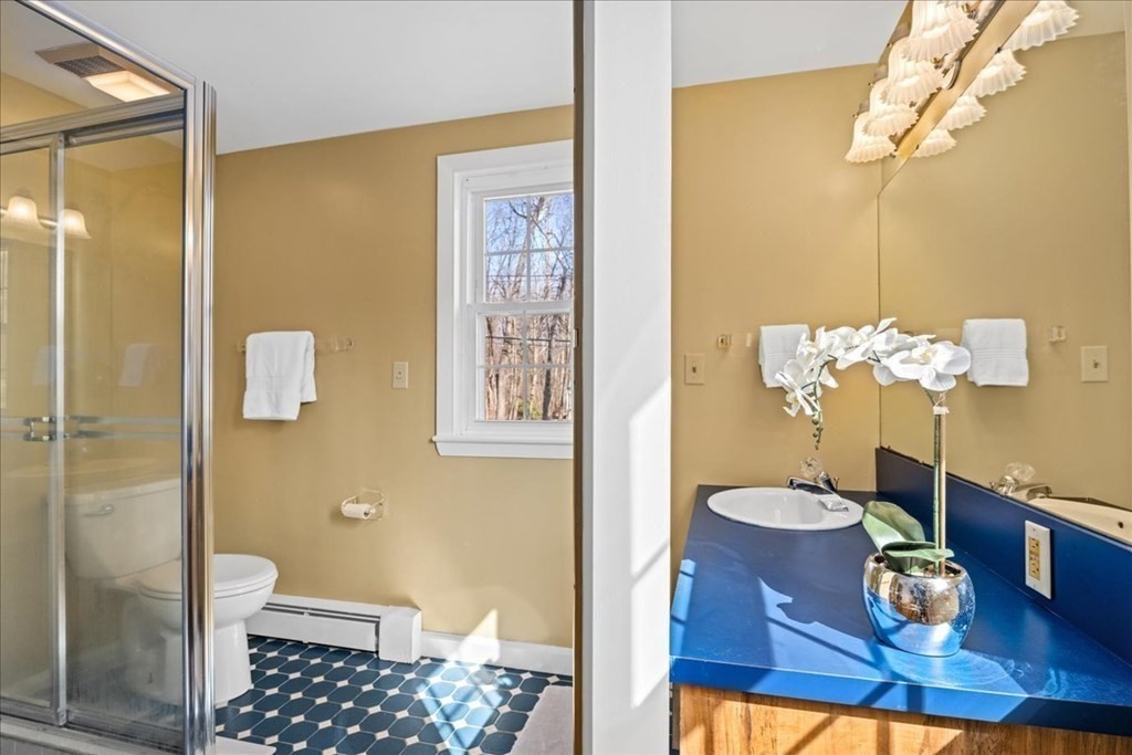 24 Oregon Road Ashland, MA 01721 - Photo 32 of 42 a bathroom with a sink a toilet and shower