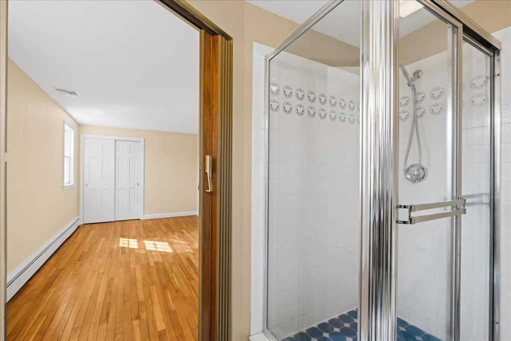 24 Oregon Road Ashland, MA 01721 - Photo 33 of 42 a view of a bathroom with a glass door