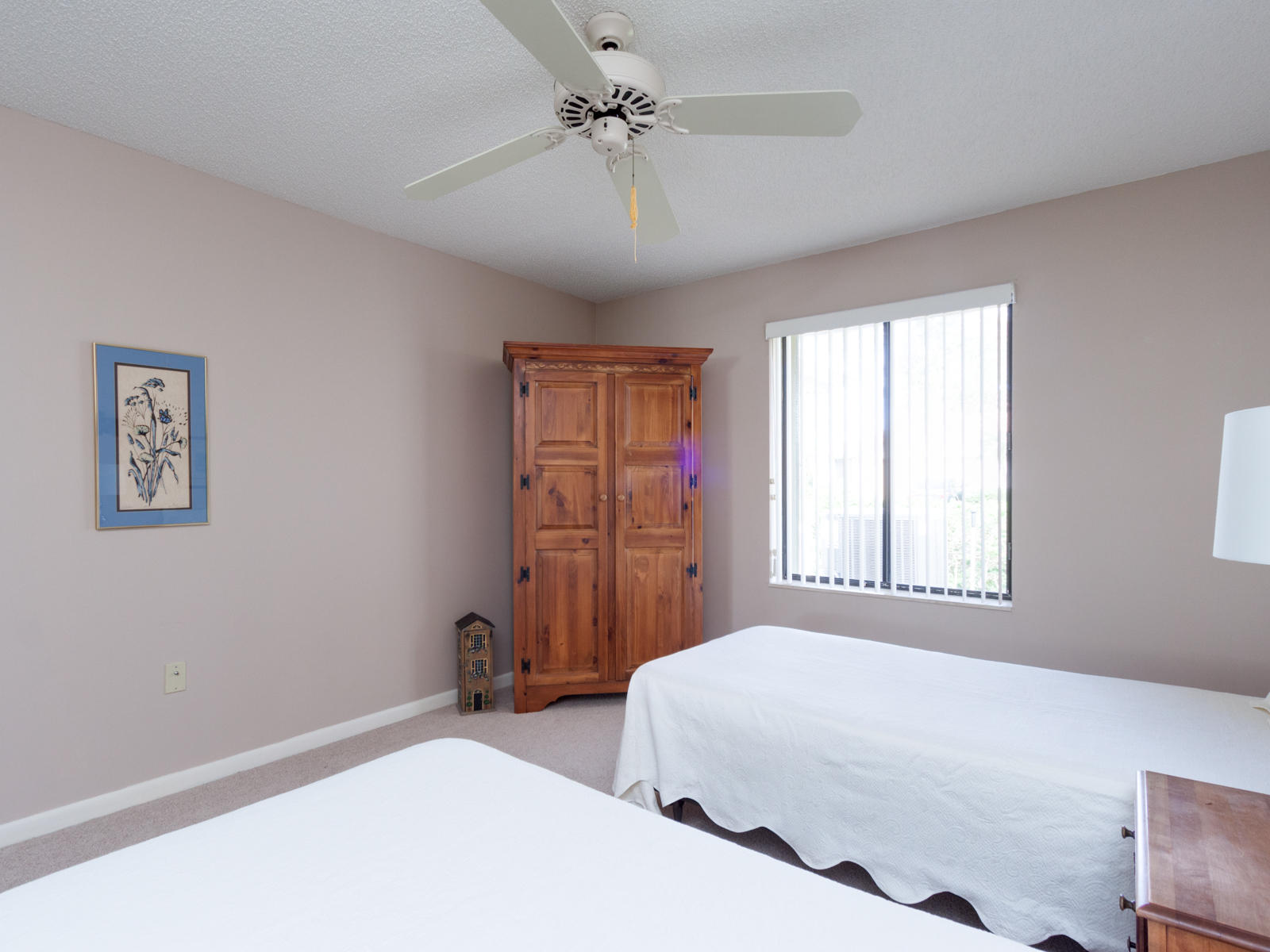 186 Ridge Road Jupiter, FL 33477 - Photo 24 of 44 a bedroom with a bed and a chandelier