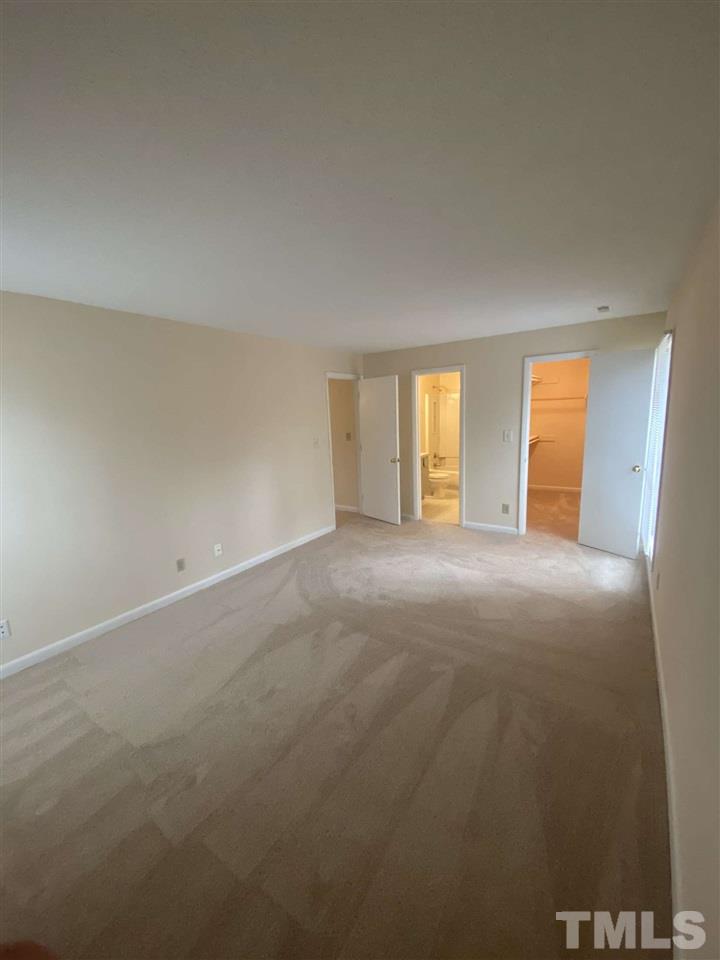 5820 Pointer Drive, Unit 202 Raleigh, NC 27609 - Photo 13 of 20 a view of an empty room with a window