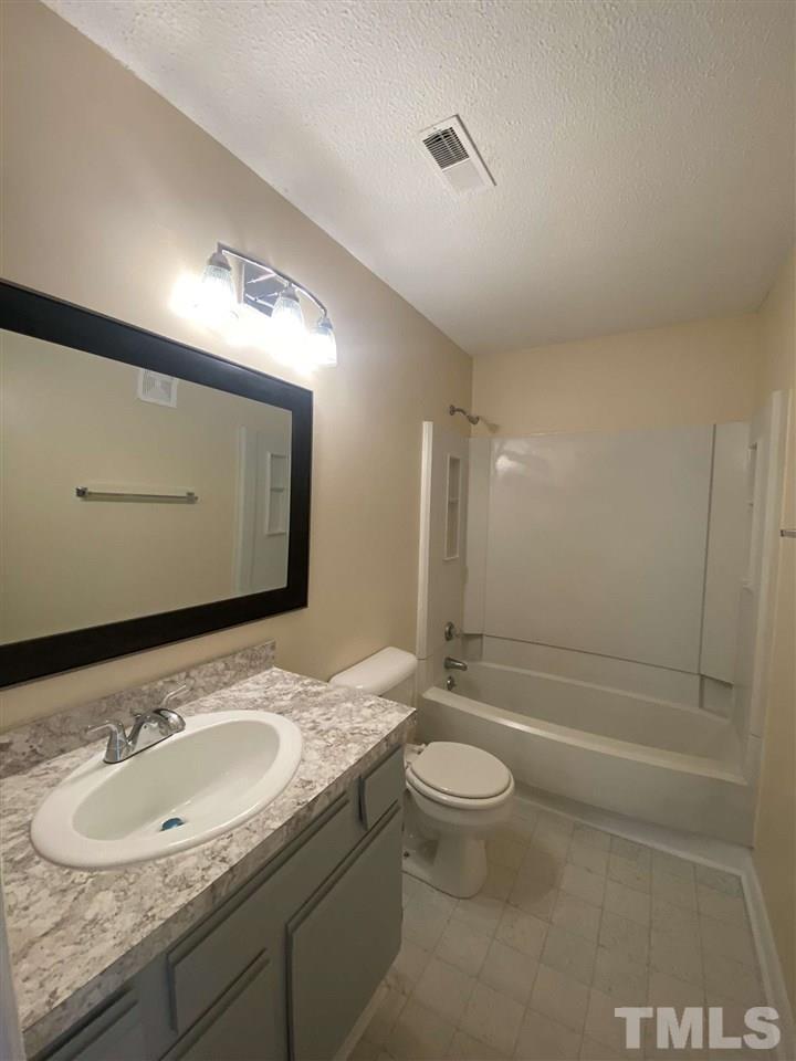 5820 Pointer Drive, Unit 202 Raleigh, NC 27609 - Photo 15 of 20 a bathroom with a sink and a mirror