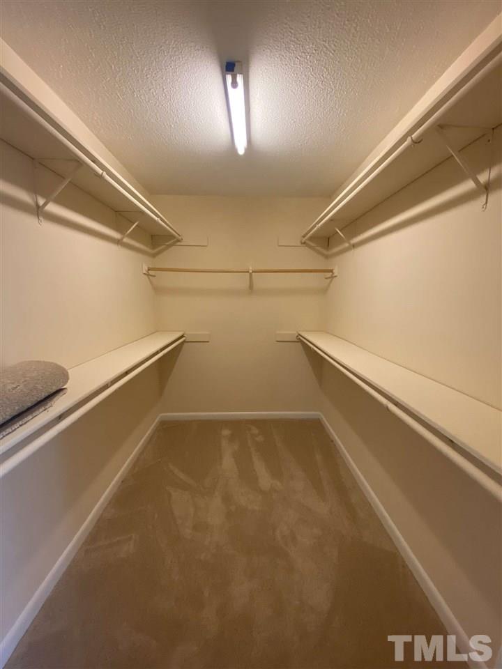 5820 Pointer Drive, Unit 202 Raleigh, NC 27609 - Photo 16 of 20 a view of a room with racks on the wall