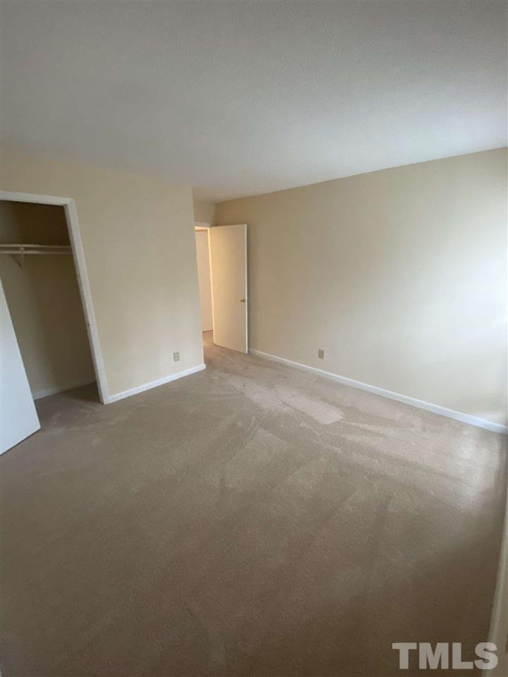 5820 Pointer Drive, Unit 202 Raleigh, NC 27609 - Photo 17 of 20 a view of an empty room and window