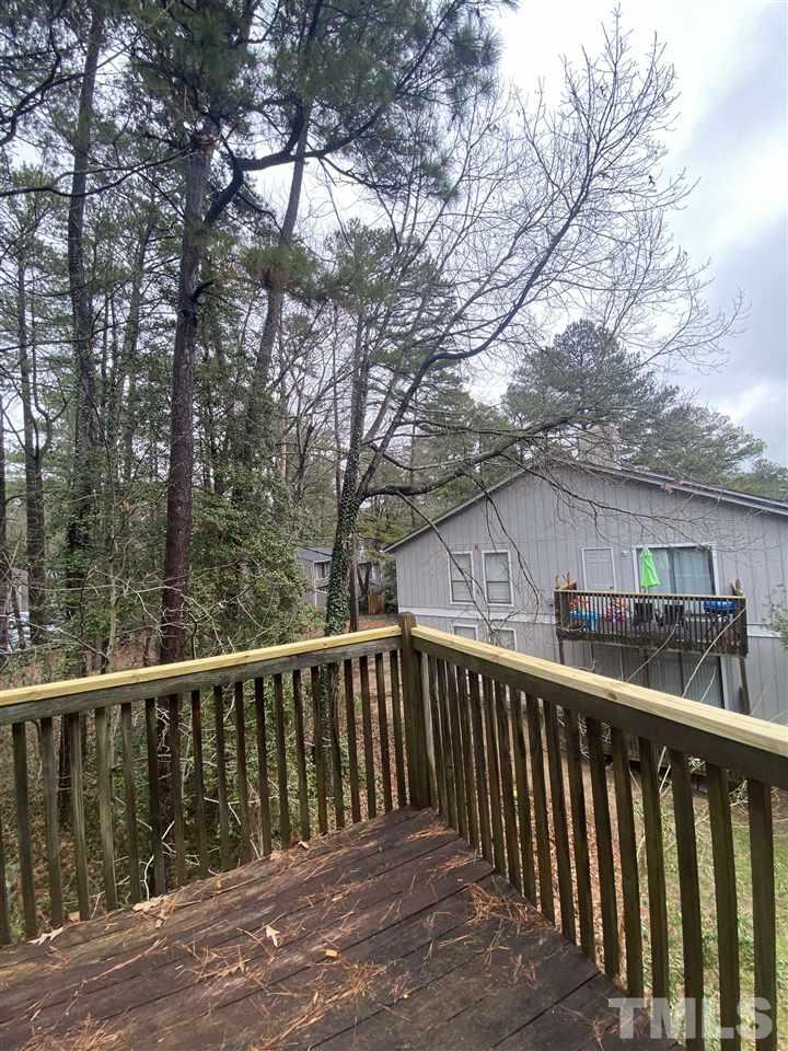 5820 Pointer Drive, Unit 202 Raleigh, NC 27609 - Photo 19 of 20 a view of house with wooden deck and outdoor space