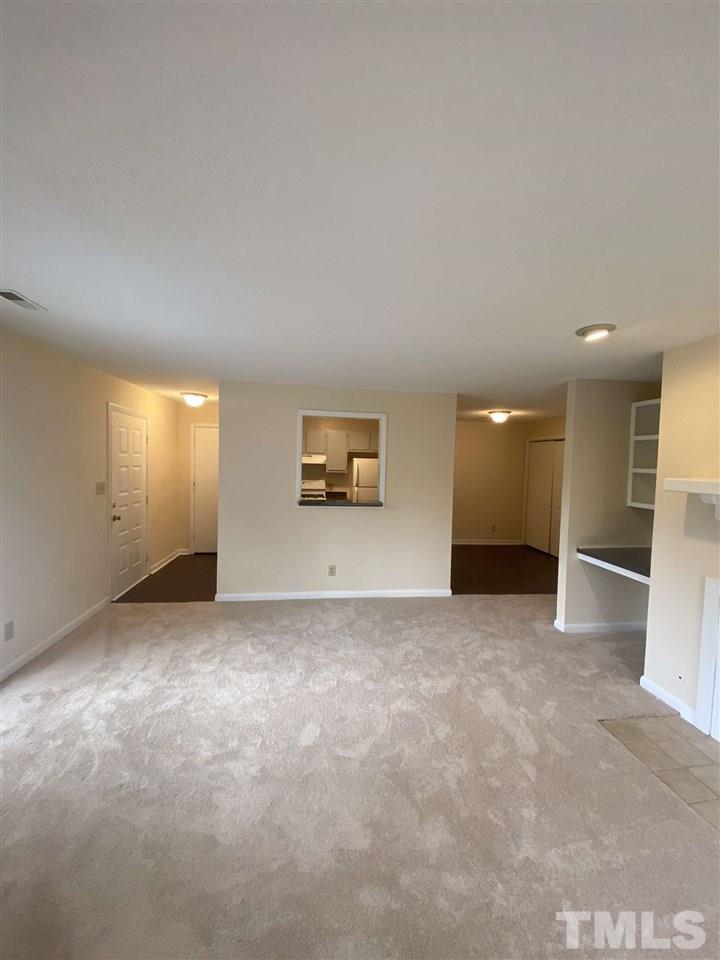 5820 Pointer Drive, Unit 202 Raleigh, NC 27609 - Photo 3 of 20 an empty room with windows
