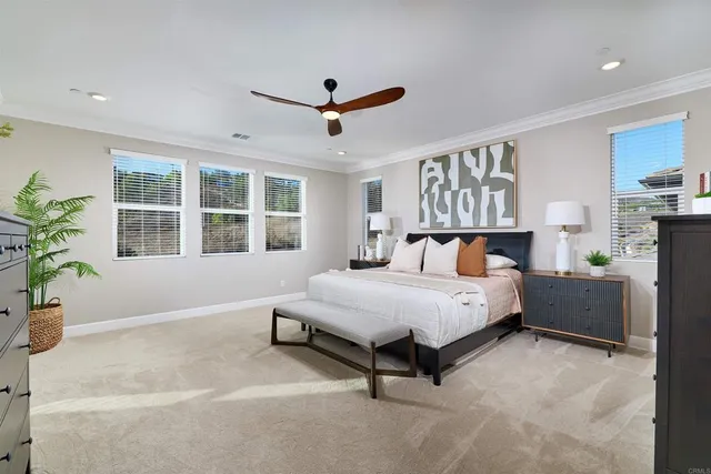 a spacious bedroom with a large bed and a window