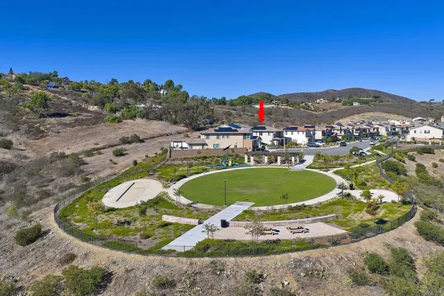 a view of a swimming pool with a yard and mountain view
