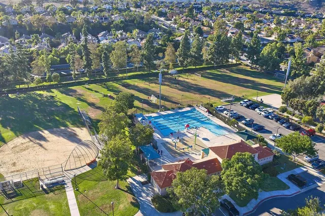 an aerial view of residential houses with outdoor space