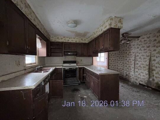 6927 Delaware Street Merrillville, IN 46410 - Photo 5 of 13 a kitchen with stainless steel appliances granite countertop a stove a sink a refrigerator and a microwave