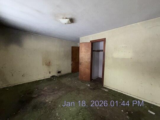 6927 Delaware Street Merrillville, IN 46410 - Photo 9 of 13 an empty room with a door