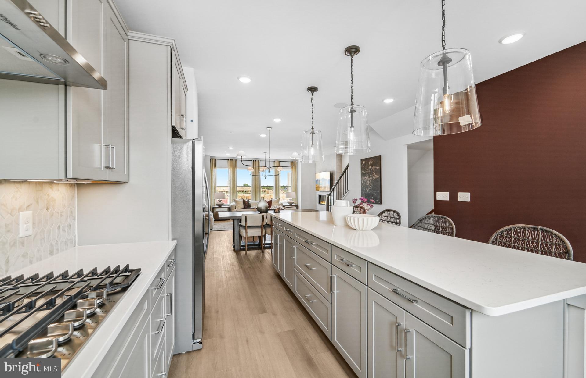 502 Crossvine Lane Laurel, MD 20724 - Photo 12 of 61 a large kitchen with stainless steel appliances kitchen island a large island in the center