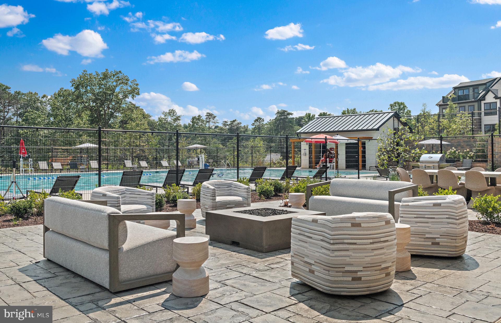 502 Crossvine Lane Laurel, MD 20724 - Photo 61 of 61 a view of a patio with couches chairs and a fire pit