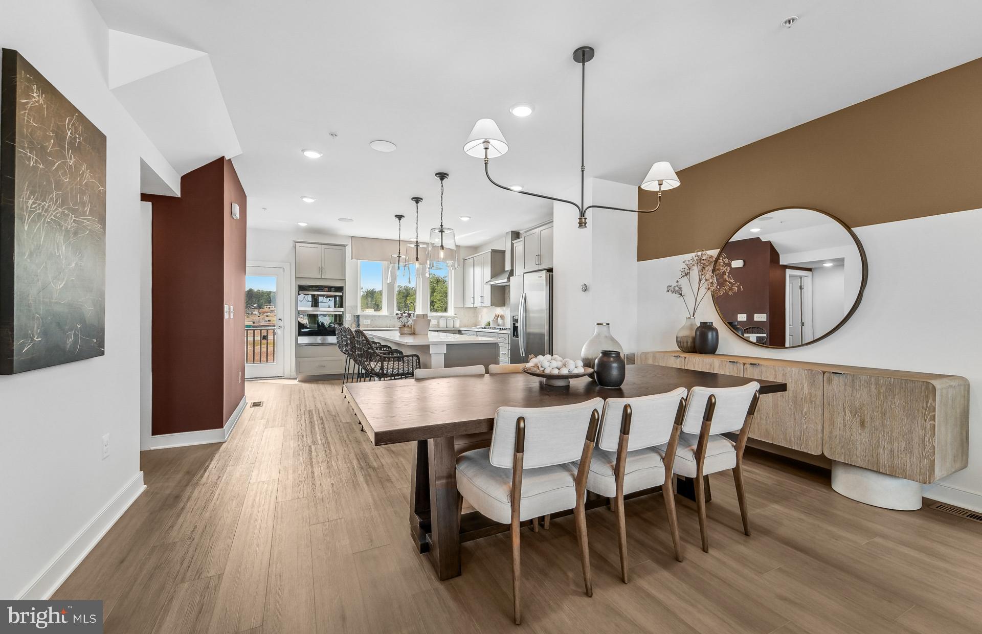 502 Crossvine Lane Laurel, MD 20724 - Photo 9 of 61 a view of a dining room with furniture and wooden floor