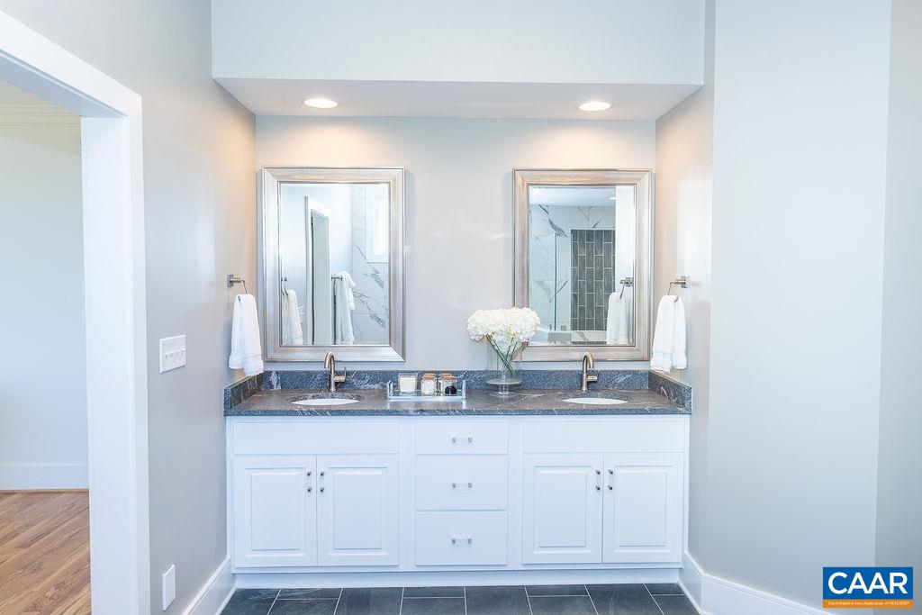 2399 Summit Ridge Trail Charlottesville, VA 22911 - Photo 26 of 54 a bathroom with a sink and a mirror