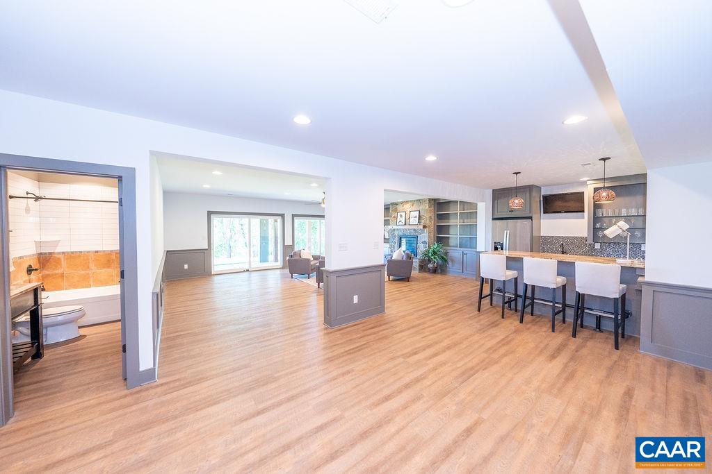 2399 Summit Ridge Trail Charlottesville, VA 22911 - Photo 35 of 54 a living room with furniture and a wooden floor