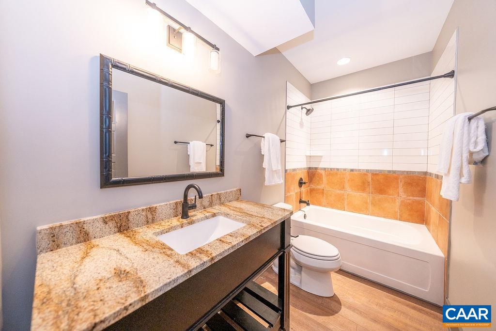 2399 Summit Ridge Trail Charlottesville, VA 22911 - Photo 41 of 54 a bathroom with a granite countertop sink toilet and mirror