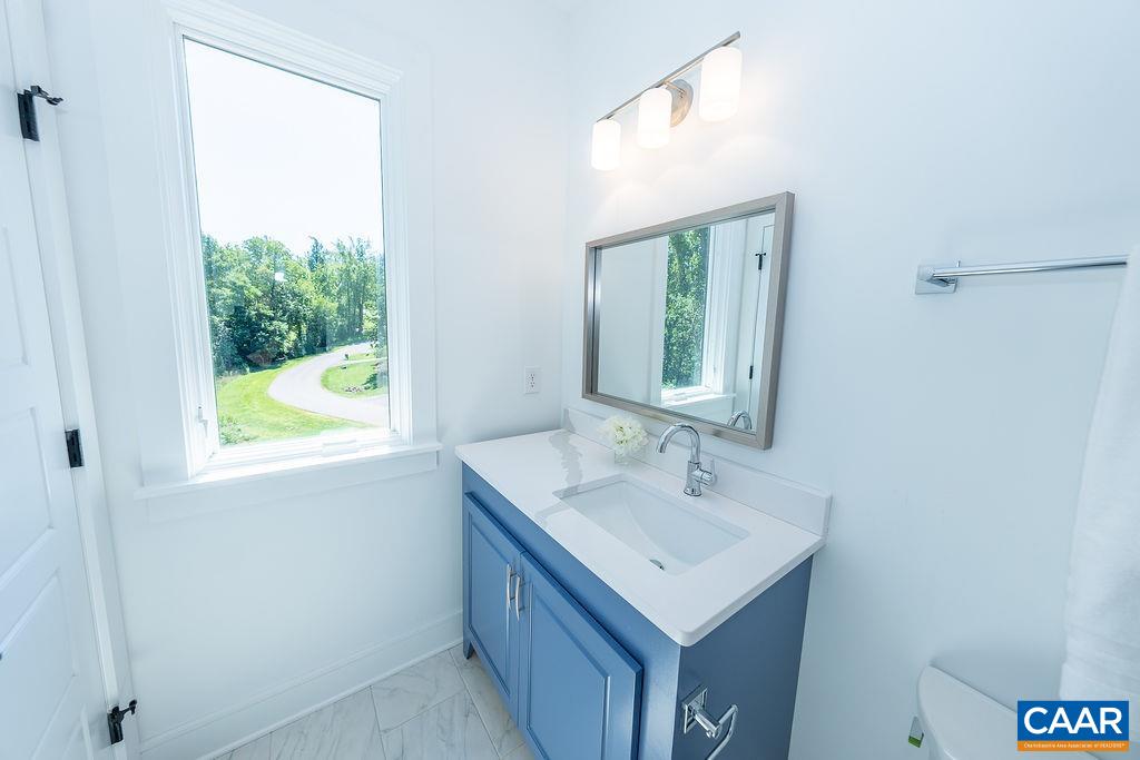 2399 Summit Ridge Trail Charlottesville, VA 22911 - Photo 43 of 54 a bathroom with a sink vanity and a mirror