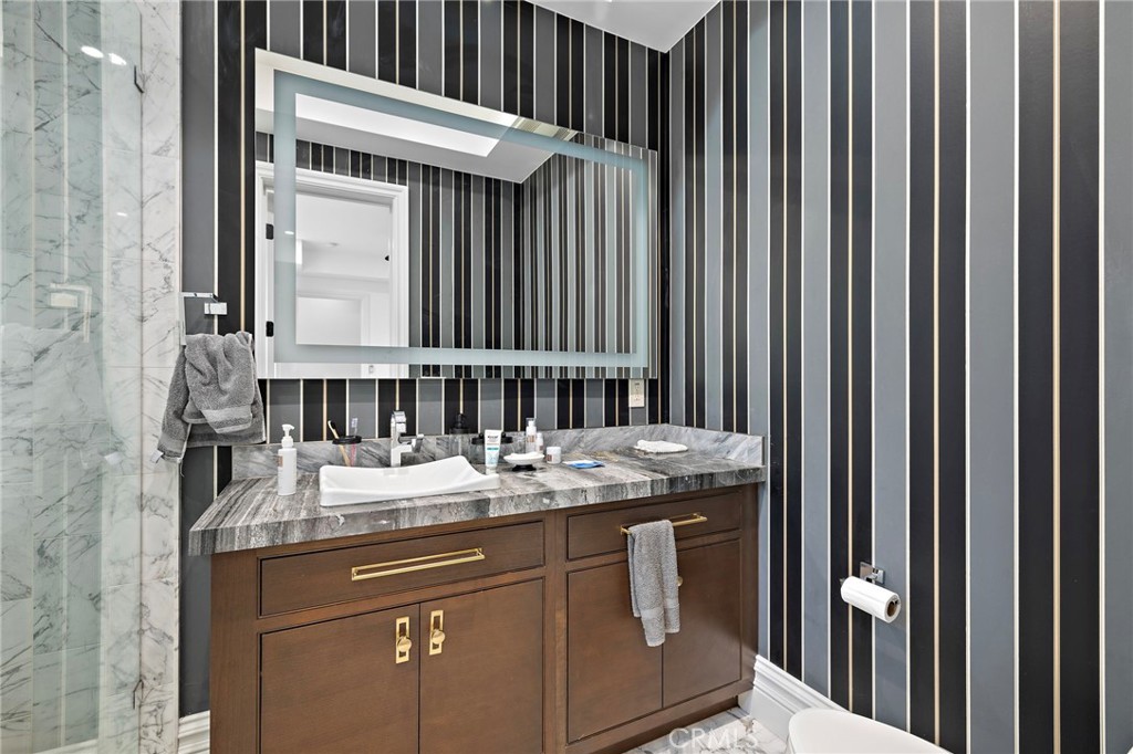 3202 Portico Del Norte San Clemente, CA 92673 - Photo 24 of 62 a bathroom with a granite countertop sink and a mirror