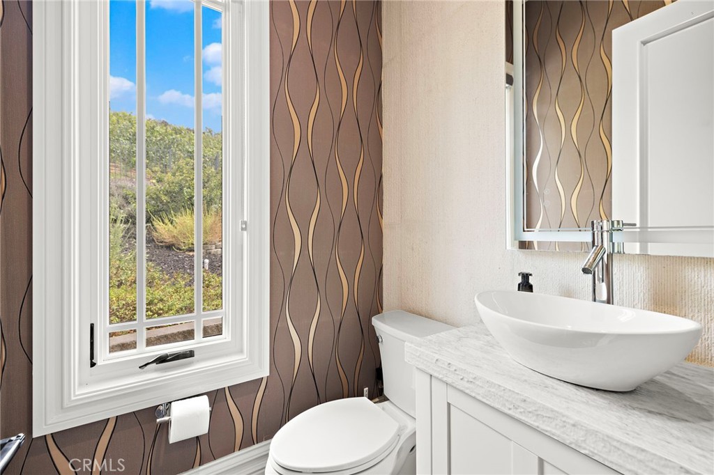 3202 Portico Del Norte San Clemente, CA 92673 - Photo 27 of 62 a bathroom with a toilet sink and mirror