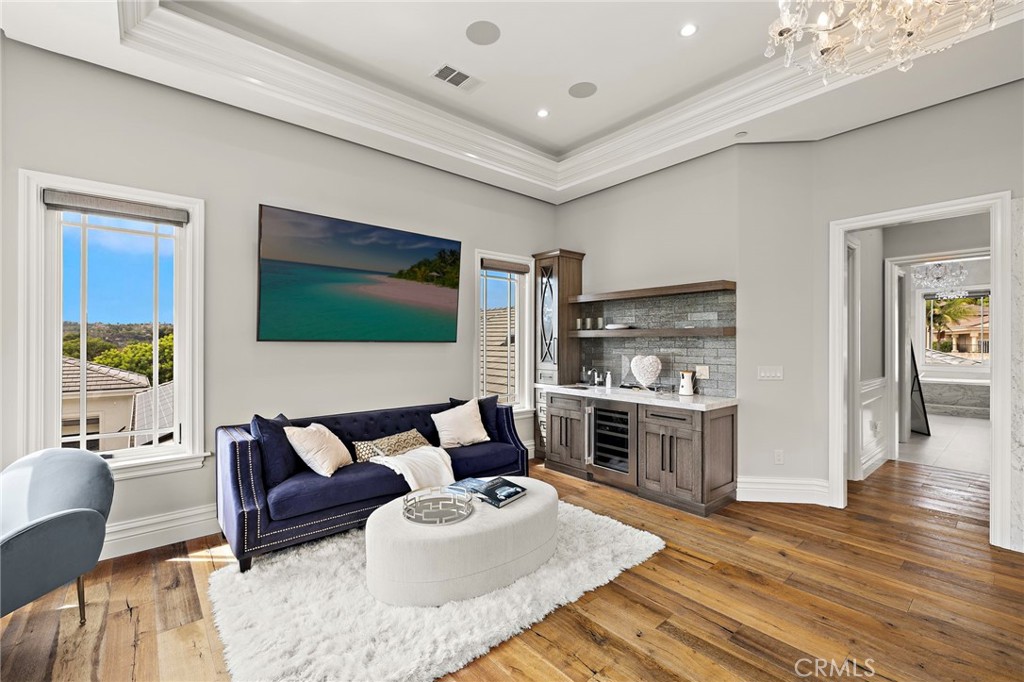 3202 Portico Del Norte San Clemente, CA 92673 - Photo 30 of 62 a living room with furniture flat screen tv and kitchen view