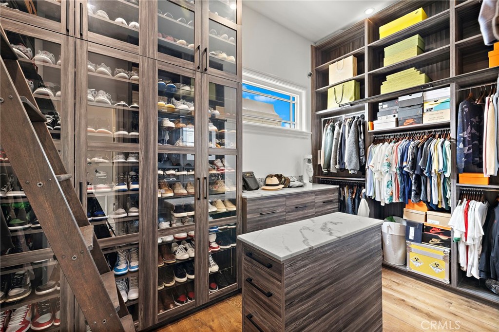 3202 Portico Del Norte San Clemente, CA 92673 - Photo 32 of 62 a view of walk in closet with clothes and shoes