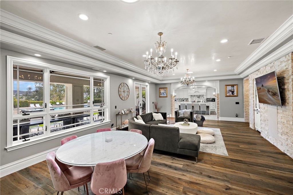 3202 Portico Del Norte San Clemente, CA 92673 - Photo 37 of 62 a living room with furniture a chandelier and a flat screen tv