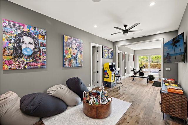 a front view of a house with swimming pool having outdoor seating